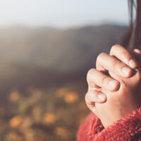 Photo of calm hands resting together, representing patience during a gradual recovery process.